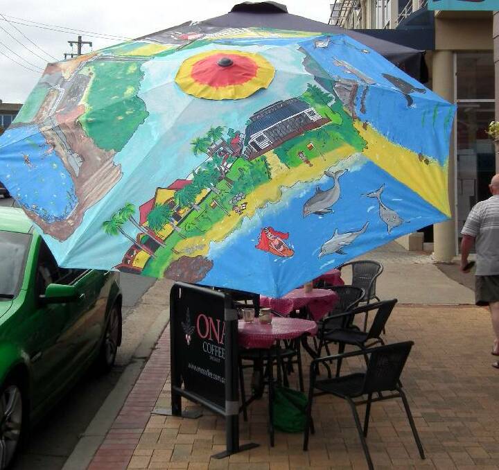 LATEST UMBRELLA: The latest umbrella to be completed, painted by Jenny McCabe of Bermagui. The colours are so vibrant that it will stand out well and it is entitled "Our Beautiful Bermagui". 