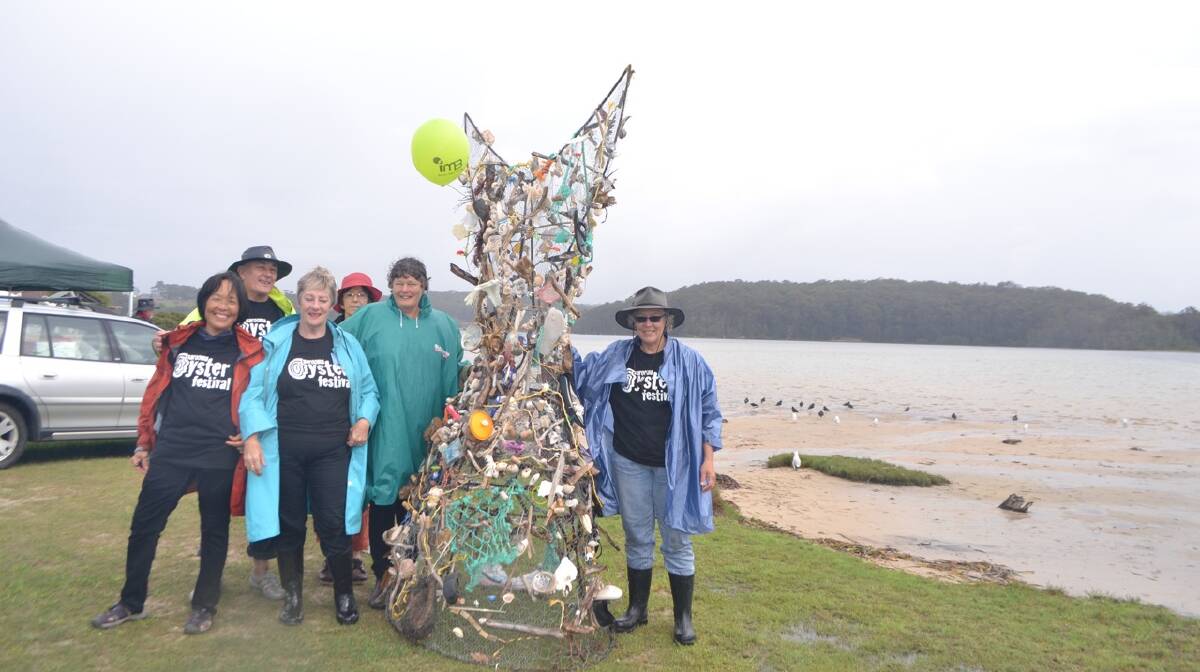 WHALE TAIL: KITE MAKERS: Showing off the Narooma Oyster Festival whale tail are Tony Pye, Richard Nipperess, Oung Niennattrakul, Vivienne Bose-Wood, arts coordinator Judy Glover, Dorothy Noble and Chris Perrott. Photo Stan Gorton