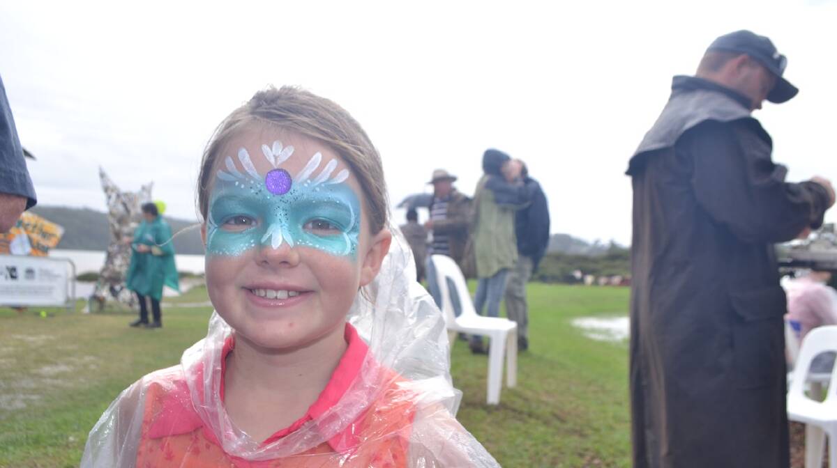 PAINTED GIRL: Lani Rogerson show off her face painting at the Narooma Oyster Festival. Photo Stan Gorton