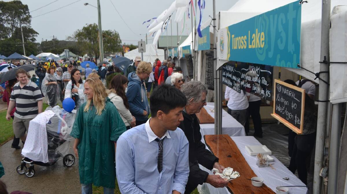 QUITE BUSY: The crowd looked quite good at the peak of the Narooma Oyster Festival. Photo Stan Gorton