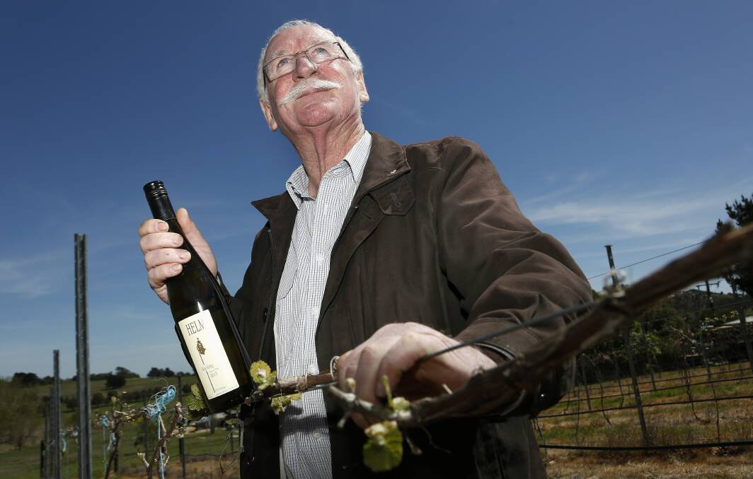 Wine maker Ken Helm with a bottle of one of Helm Wines award winning drops. Fairfax image.
