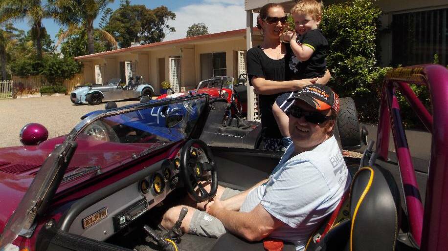 PASSION FOR CARS: Rochelle Boyer, Michael Gardner and son Jack; the organisers of the event and owners of the Farnboro Motel.