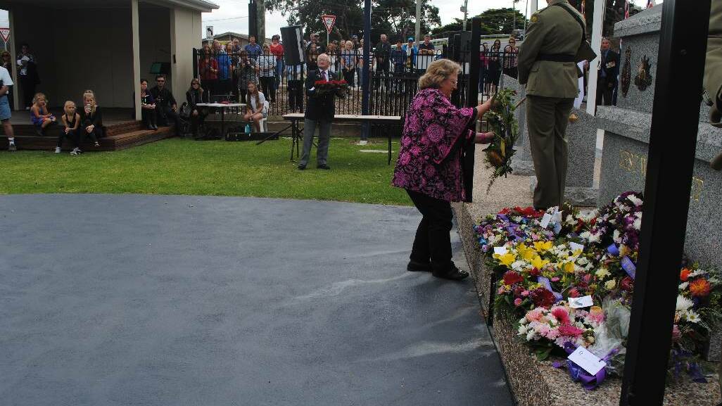 WREATH: Laying a wreath at the Narooma War Memorial is Narooma CWA president Joanne King.