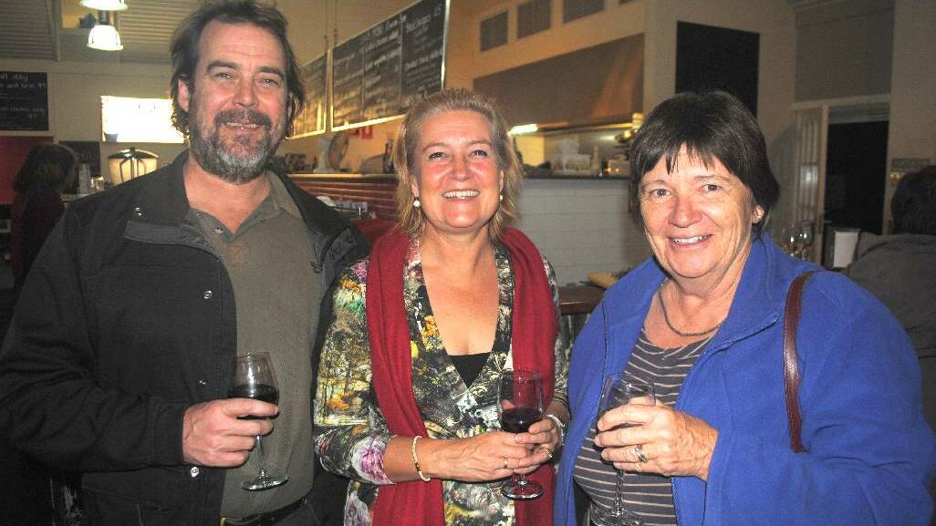 TASTY: David and Rachel McInnes of Potato Point chat to Narooma’s Laurelle Pacey at the Dairy Shed on Friday night.