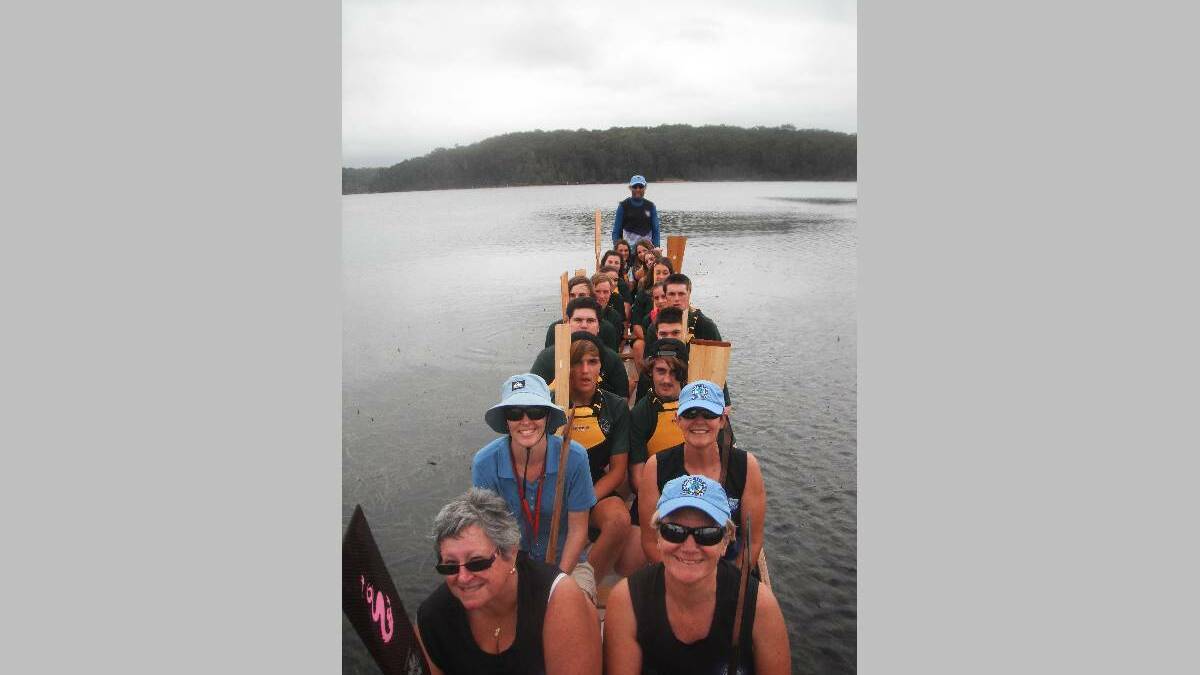 DRAGON BOATERS: Blue Water Dragons Helen Hayes, Kathryn Essex, Melissa Café, Donna Anderson followed by Years 9 and 10 Narooma High School students and sweep Peter Essex. Photo by coach Leck Swadling.