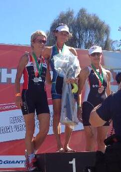 AUSSIE TITLE: Narooma High School PDHPE teacher Sally Jeffrey on the podium after winning her second Australian title in the Gatorade Australian Triathlon Championships.