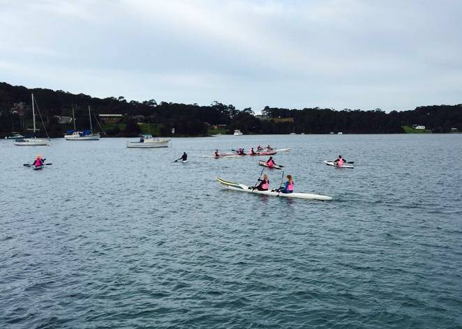SKI PADDLERS: The surf ski paddlers assemble on Forsters Bay before heading off on the 6km course up and down Wagonga Inlet. Photo from Broulee Surf Life Saving Club’s Facebook page.