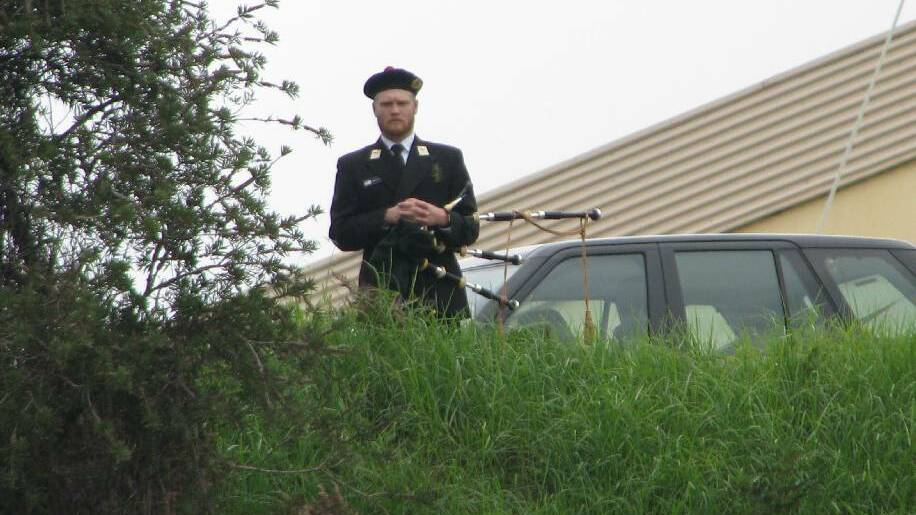 PIPER: The lone piper on the hill played the bagpipes.