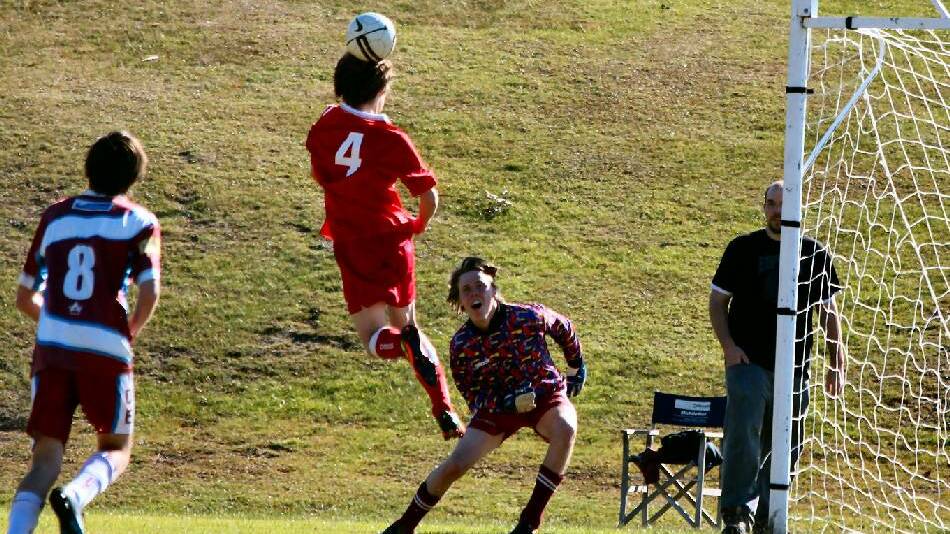 REDBACK STYLE: Sam Negus jumps for a fantastic header and attempt at goal. Photo by Allison Aitken