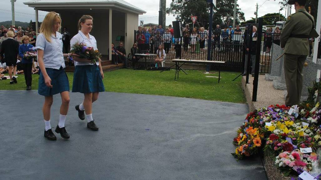 WREATH: Students from schools in the Eurobodalla laying a wreath at the Narooma War Memorial at the ANZAC Day ceremony.