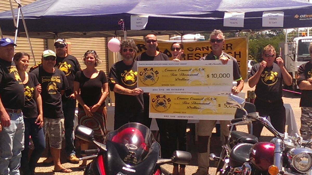 CHEQUES PRESENTED: Bermagui CRABS chapter founder Rob Grimstone, holding the cheques on the left, and the other bikers hand over the cheques in Bermagui on Saturday.