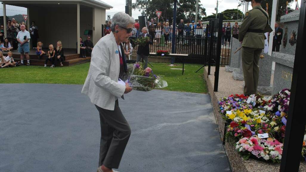 WREATH: Laying a wreath at the Narooma War Memorial is Margaret Saker.
