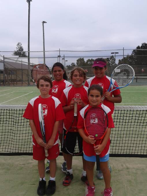 TENNIS SCHOOL: Narooma students in red are back row - Jemma Laurie and Chelsea Laurie, middle row - AJ Foster, front row - Jarrod Manton and Sophie Foster.