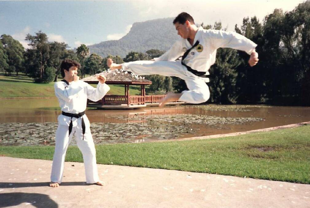 SELF-DEFENCE: Former police officer Garry Traynor in action in his younger days performing a flying side kick.