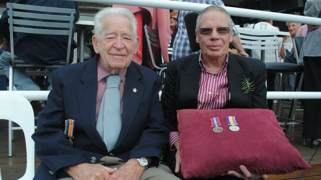 MEDALS: WWII veteran 97-year-old George Findley of Dalmeny with his son Bruce.  George was finally awarded his service medals from WWII at the ANZAC Day ceremony in Narooma.