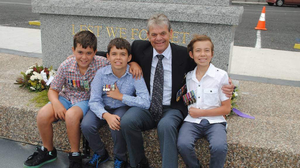 GRANDSON’S: Vietnam Veteran, Narooma’s Trevor Bennett with his three grandsons from left, Cooper Blewitt aged nine, Daniel Blewitt aged 10 and Christain Blewitt from Coffs Harbour.
