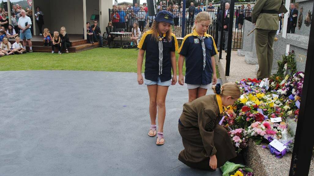 WREATH: Students from schools in the Eurobodalla laying a wreath at the Narooma War Memorial at the ANZAC Day ceremony.
