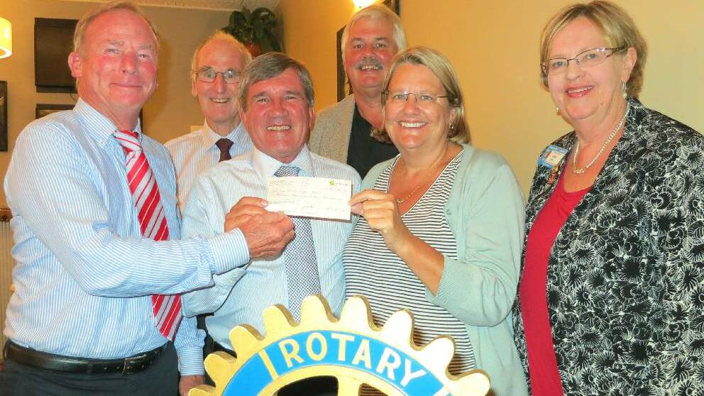 RACES A WIN: At the cheque presentation from Rotary’s Christmas at Moruya Race Day are Moruya Jockey Club president Dr Peter Atkinson, left front, Moruya Cancer Carers chairman Cr Rob Pollock, Narooma Rotary President Charmaine White, Assistant District Governor Vere Gray, Moruya Rotary president Geoff Fleming, back left, and Batemans Bay Rotary President David Ashford.