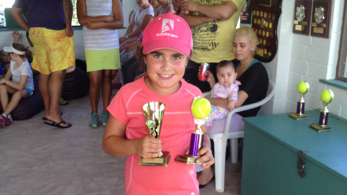 SINGLES WINNER: Sophie Foster with her winner trophy in 9/U girls at the South East Region Medibank Junior Development tournament in Ulladulla on Sunday.