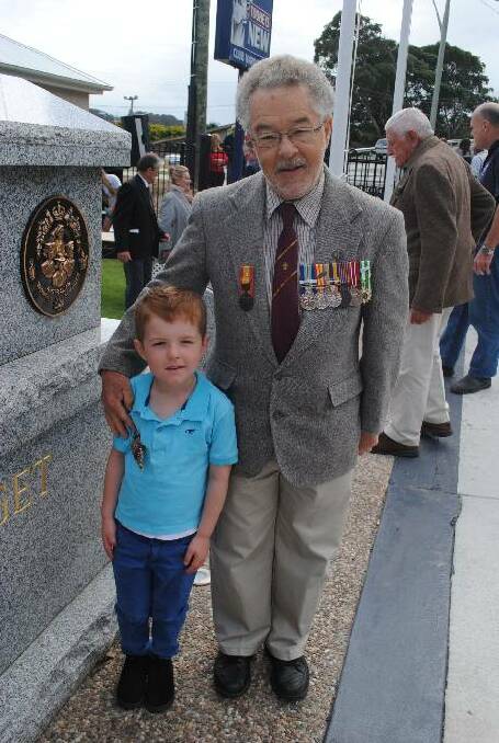 WITH GRANDAD: Karl Metcalf with his grandson Lincoln Gates nearly five years old. This was Lincoln’s first ANZAC Day with his grandfather and he was wearing his miniature medals