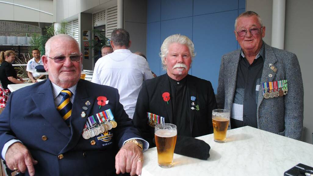 COMMEMORATING: Don Shepherd from New Zealand, Ken Shepherd and Gary Breust of Narooma enjoying an ale after the ANZAC Day Ceremony in Narooma.