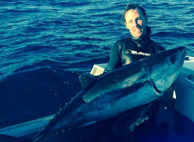 OPEN WATER: Chris Bamman with a 41kg speared bluefin tuna.