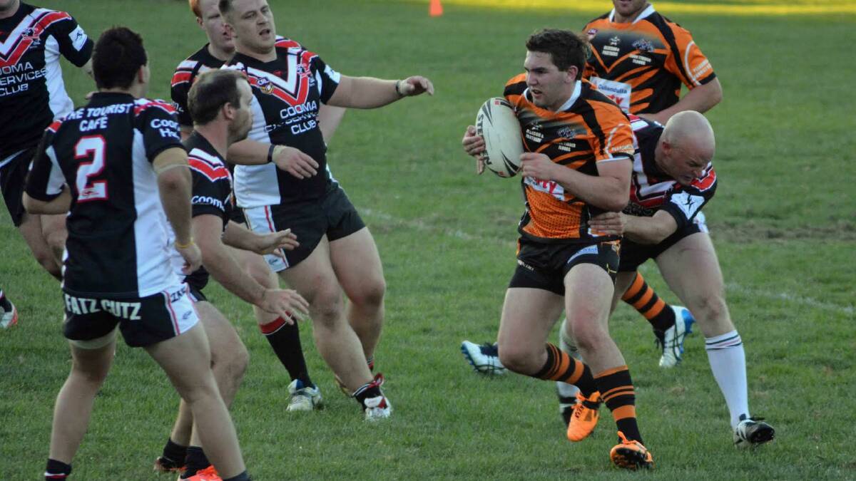 HIT UP: Baden Payne runs the ball during Batemans Bay's first round clash with Cooma. 