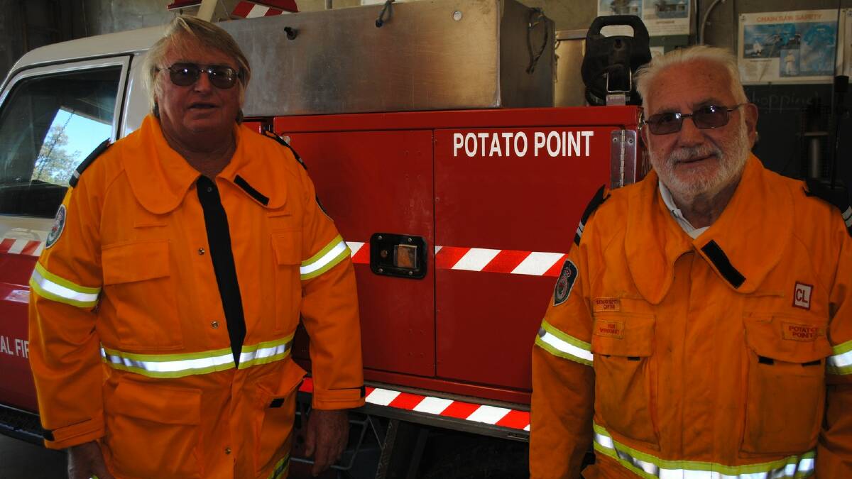 RIPPED OFF: Deputy captain and equipment officer Brian Kennedy along with Potato Point Rural Fire Brigade officer Frank Vroombout in front of one of the trucks that were broken into. 
