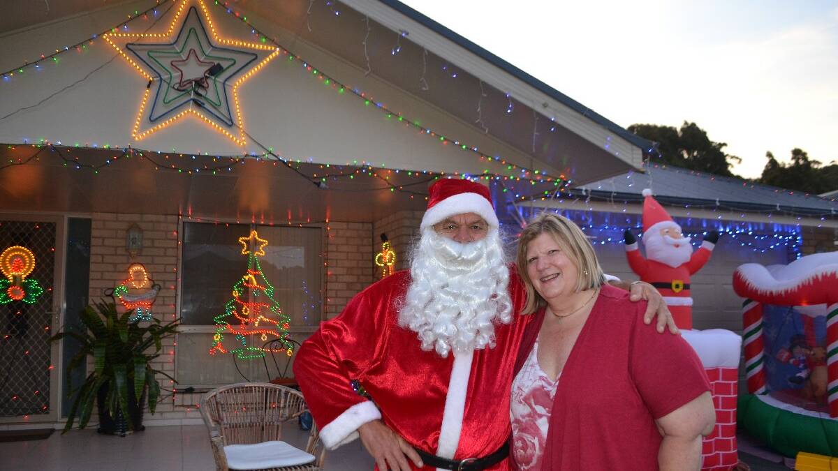 Christmas light king and queen Trevor Bennett and Angela Hanson have put their lights up for many years at 62 Warbler Crescent, Kianga
