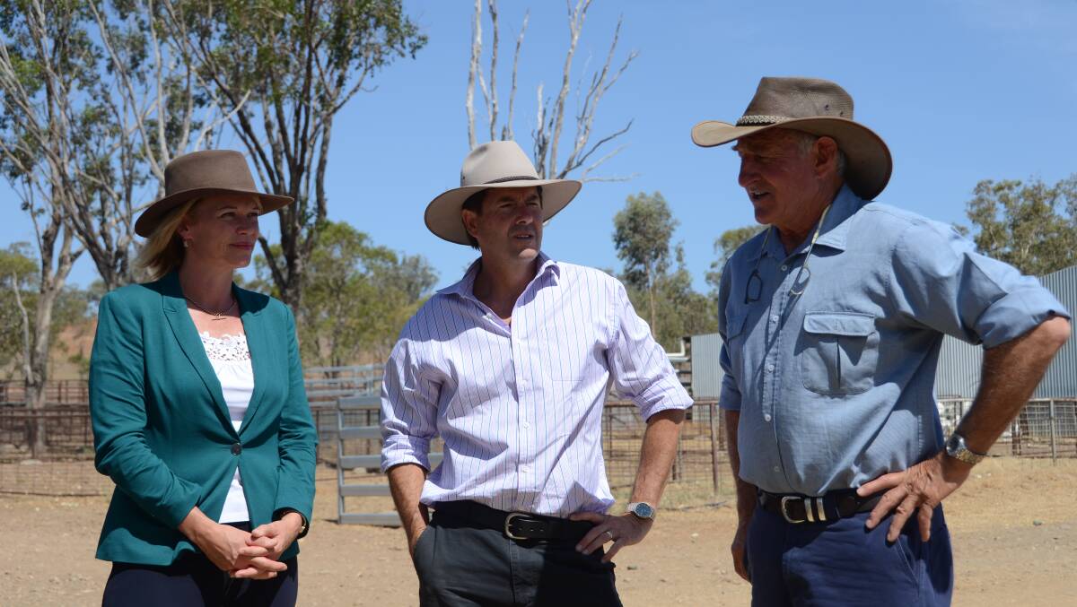Farmer Tom Woolaston at the Somerton Feedlot with Minister for Primary Industries Katrina Hodgkinson and member for Tamworth, Kevin Anderson.