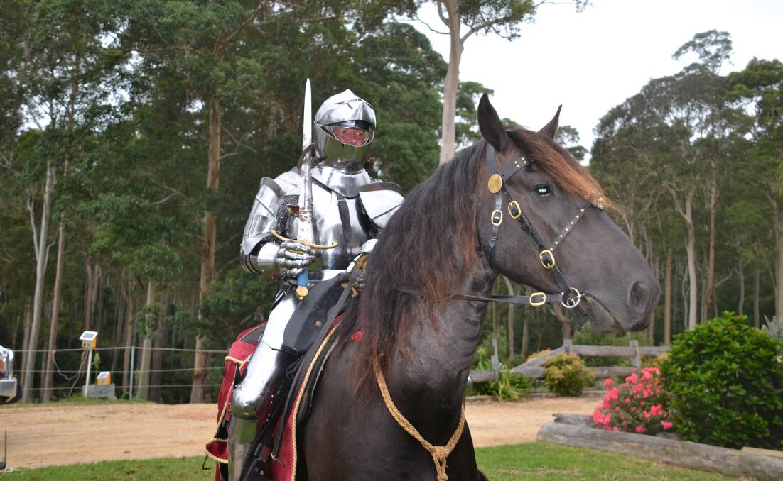 Darrell Bossley on his Friesian horse S'Calibur. Bossley is wearing a full set of 15th-century steel armour.