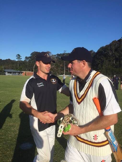 MATCH WINNER: Simon Mackie is congratulated by Nick Mason after guiding Southern Eurobodalla to victory with an unbeaten 85. Photo: Thilan Walgamage