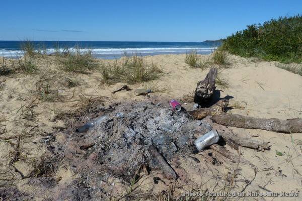DESTRUCTIVE: The remains of a fire complete with rubbish was discovered at Murrah Beach back in May. 