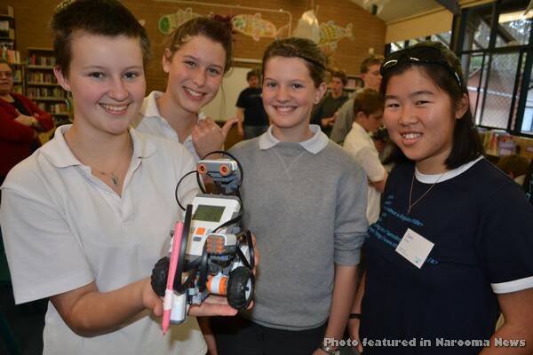 NAROOMA ROBOGALS: Narooma High School Year 8 participants in the ANU Robogals workshop included Fin Van Stekelenburg, Leiana Massie and Saphody Thompson pictured here with a LEGO NXT robot and ANU student Sam Cheah. 