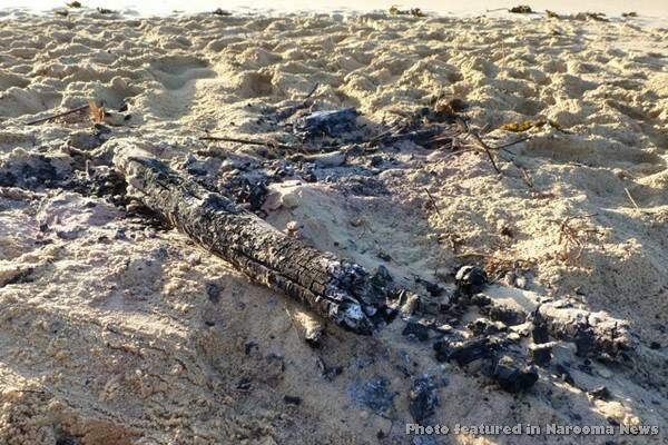 The remains of a fire discovered on Baragoot Beach on July 11.