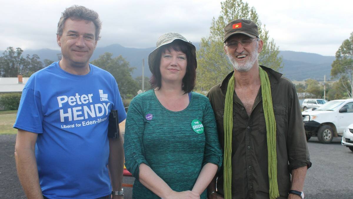 Handing out how to votes in Bemboka are (from left) Mark de Crispigny from the Liberal Party, Michelle Gaddes from the Greens and Robert Kingston from the Labor Party.