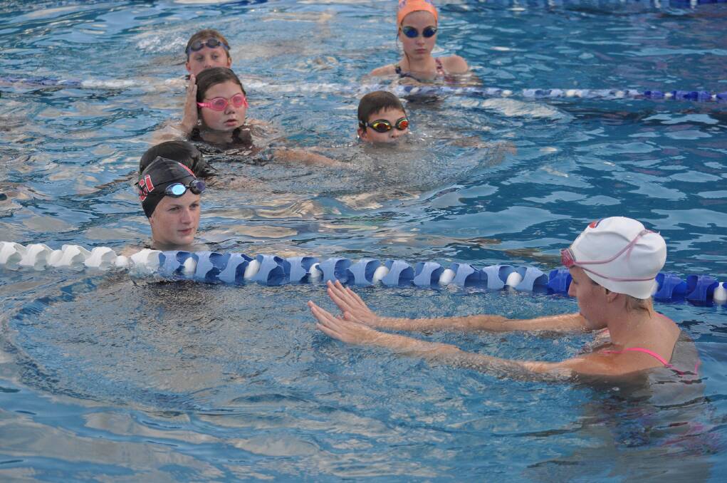 TRAINING: After the championships concluded Alicia gave a number of Cobargo swimmers an impromptu training and tips session. 