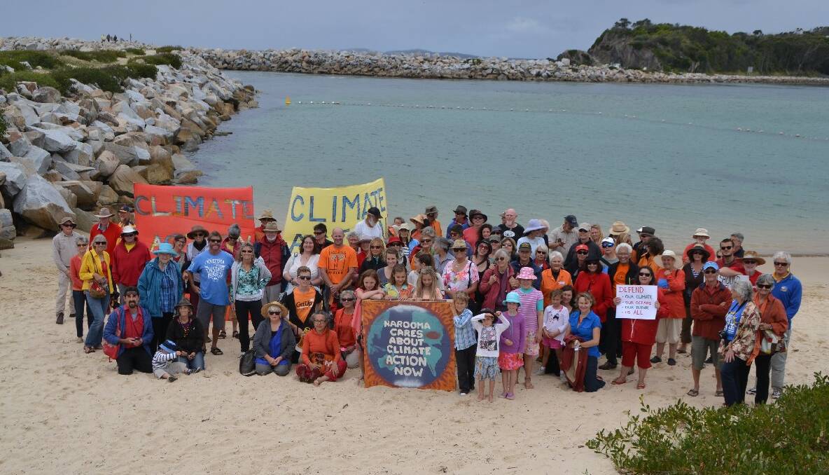 SHOW OF FORCE: The participants in Sunday’s GetUp Climate Day of Action event at Narooma gathered for the traditional group photo, with similar photos taken in cities and towns around Australia. 