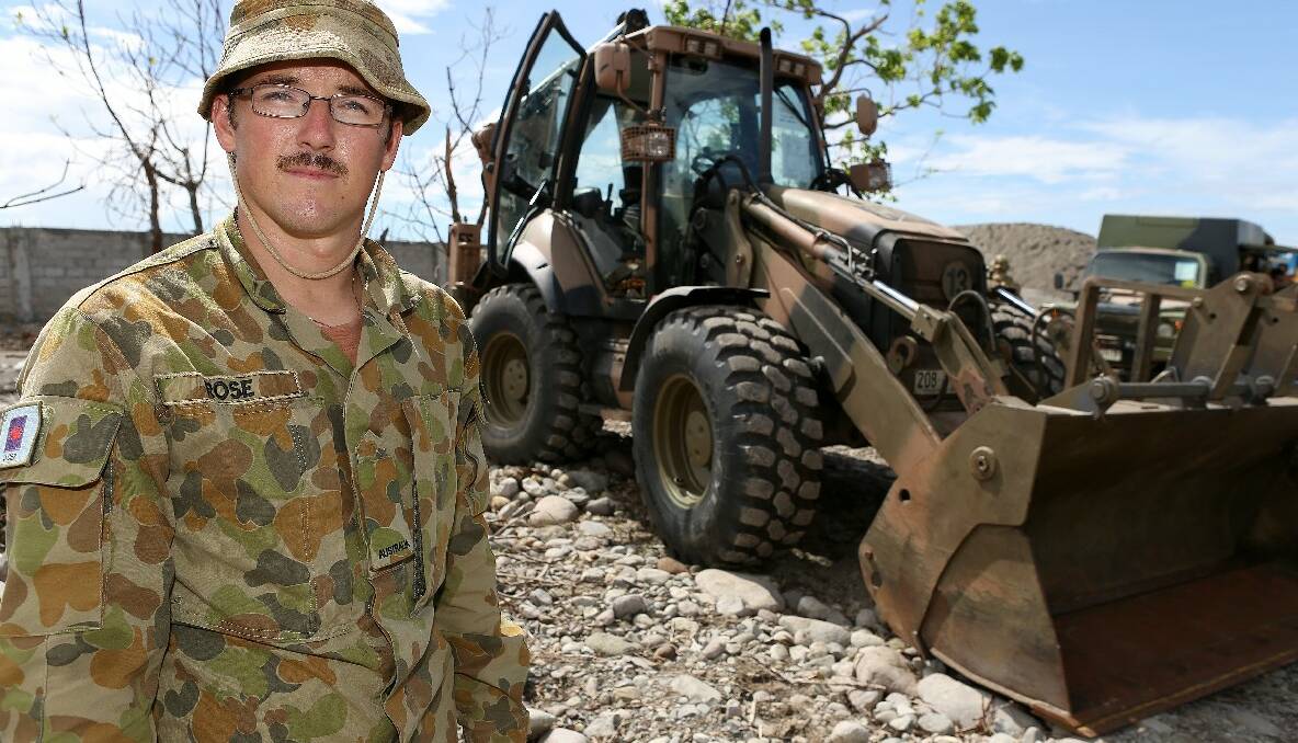 VITAL WORK: Pictured in the Philippines, a long way from the home in Narooma, is combat engineer Robert Rose. 