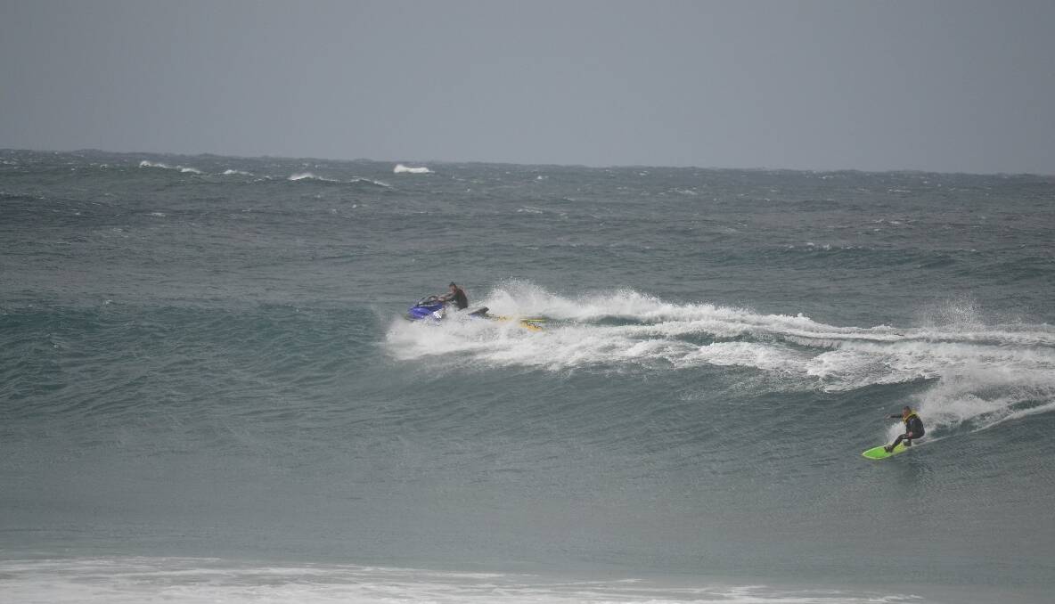 TOW-IN TIME: Morgan Evans tows in fellow local big-wave expert Tony Lawson off the Narooma bar on Friday. 