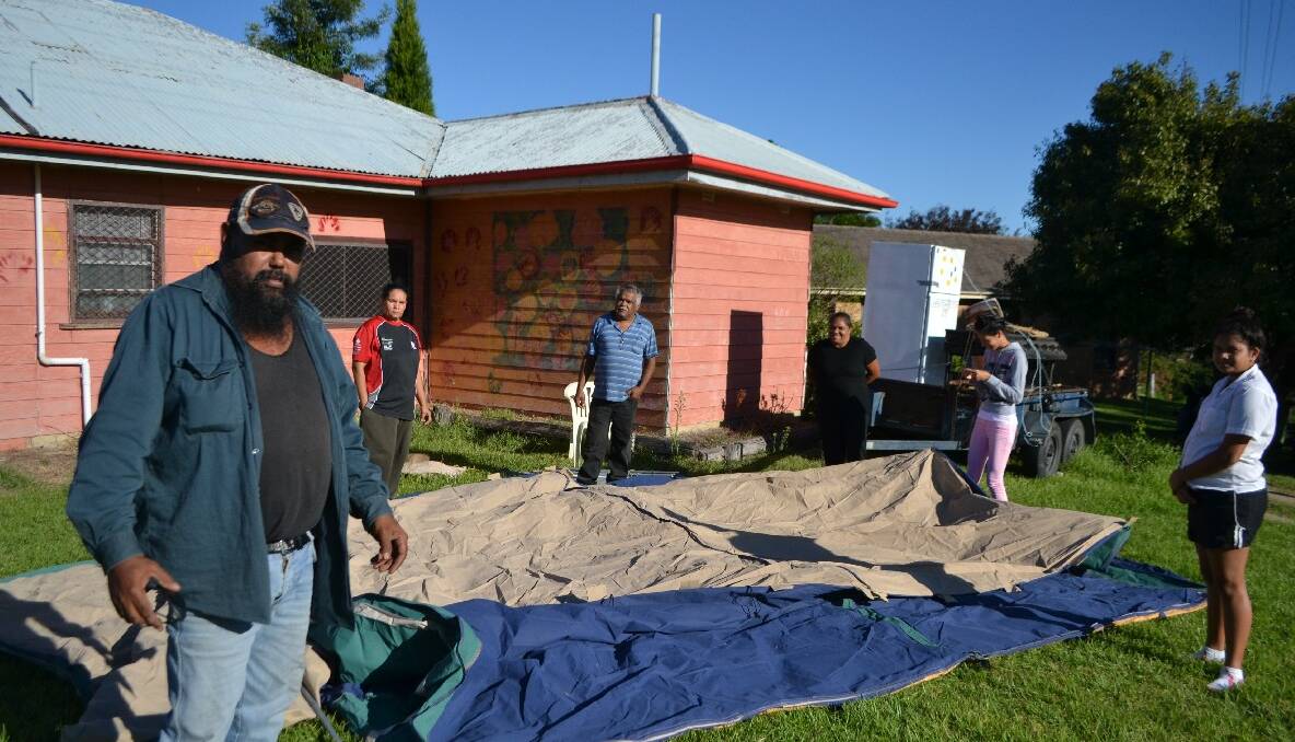 PROTEST TENT: Members of the Campbell family led by Paul and Ian set up a tent outside the Merrimans Local Aboriginal Land Council building at the Wallaga Lake Koori village on Monday afternoon. 