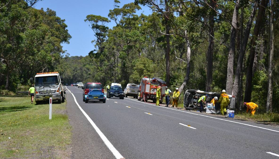 HIGHWAY CRASH: The driver of this utility was lucky to escape serious injury after swerving to avoid a turning vehicle and rolling several times on the Princes Highway south of Narooma on Sunday afternoon. 
