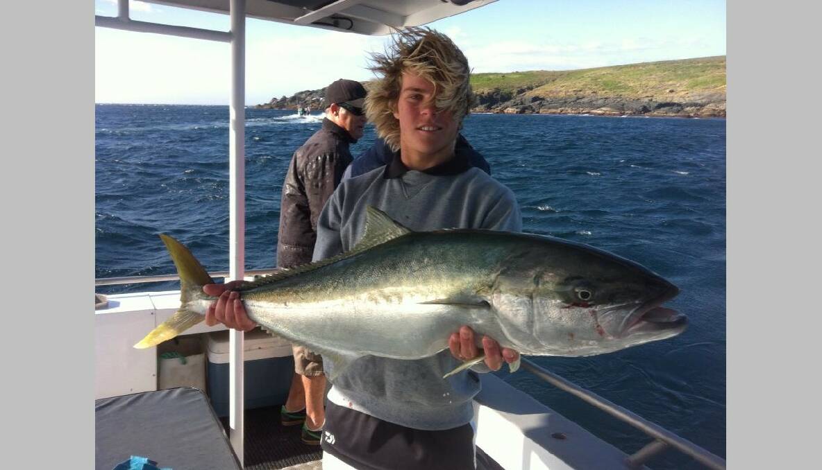 ISLAND KINGS: The kings at the island are rare but big like this 1m model being held by Charter Fish Narooma deckie Nick Cowley. 