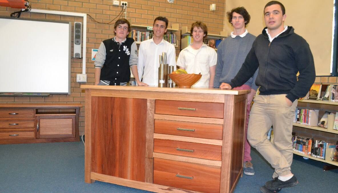 MAGNIFICENT WORK: The Industrial Technology-Timber class at Narooma High received four Band 6’s and one Band 5. Pictured back in August getting their projects marked are Lachlan Carey, Nathan Batten, Jaymin Lobo, Alex Krantz and Tim Watson. 