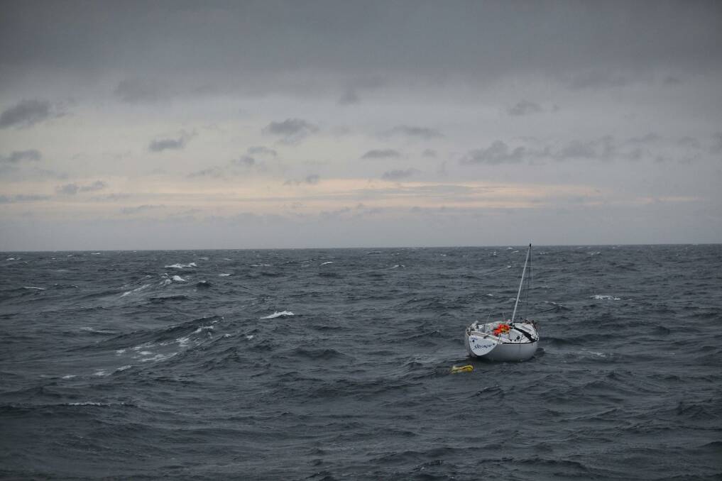 The 11-metre yacht "Streaker" which was de-masted in heavy weather, is seen from a police vessel after its captain, Glenn Ey, was rescued about 270 nautical miles east of Wollongong in this October 17, 2012 handout picture.  