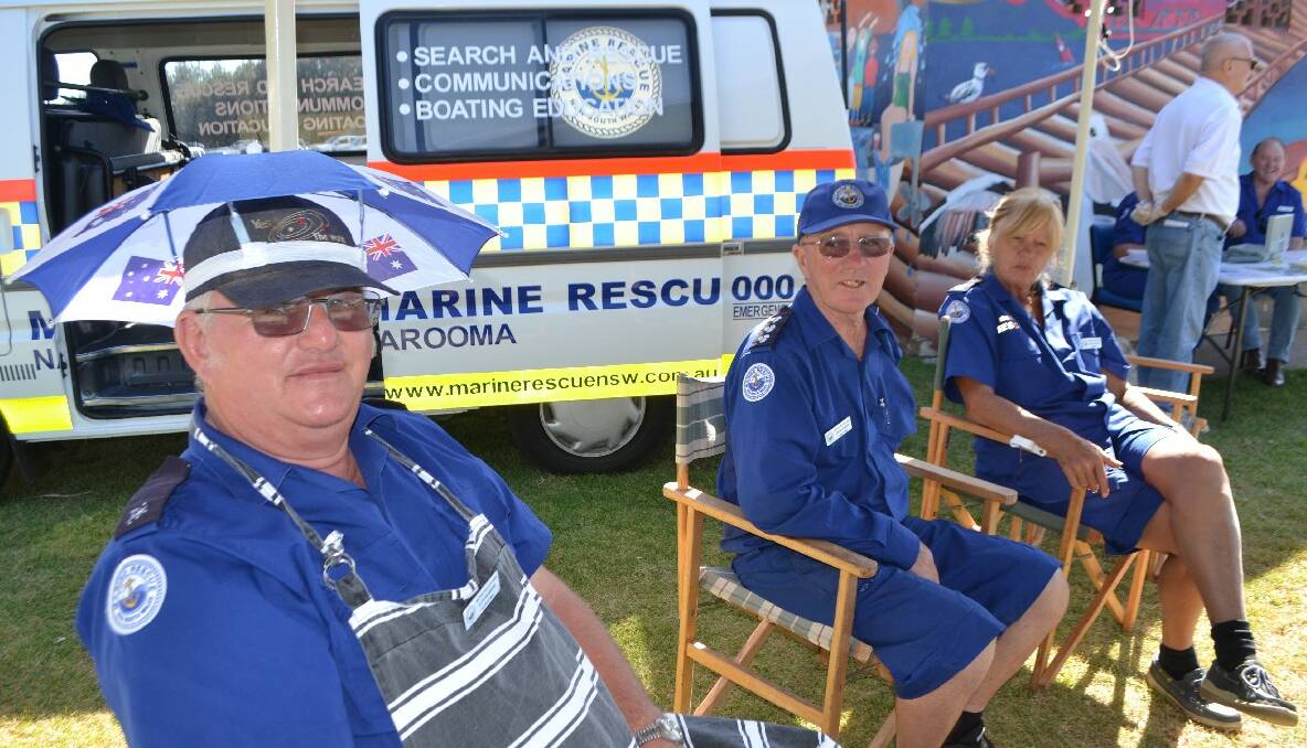 MARINE CREW: Illya Naumoski, John and Ronja Young from Marine Rescue Narooma selling sausages to returning boaties down at Apex Park on Australia Day morning. 