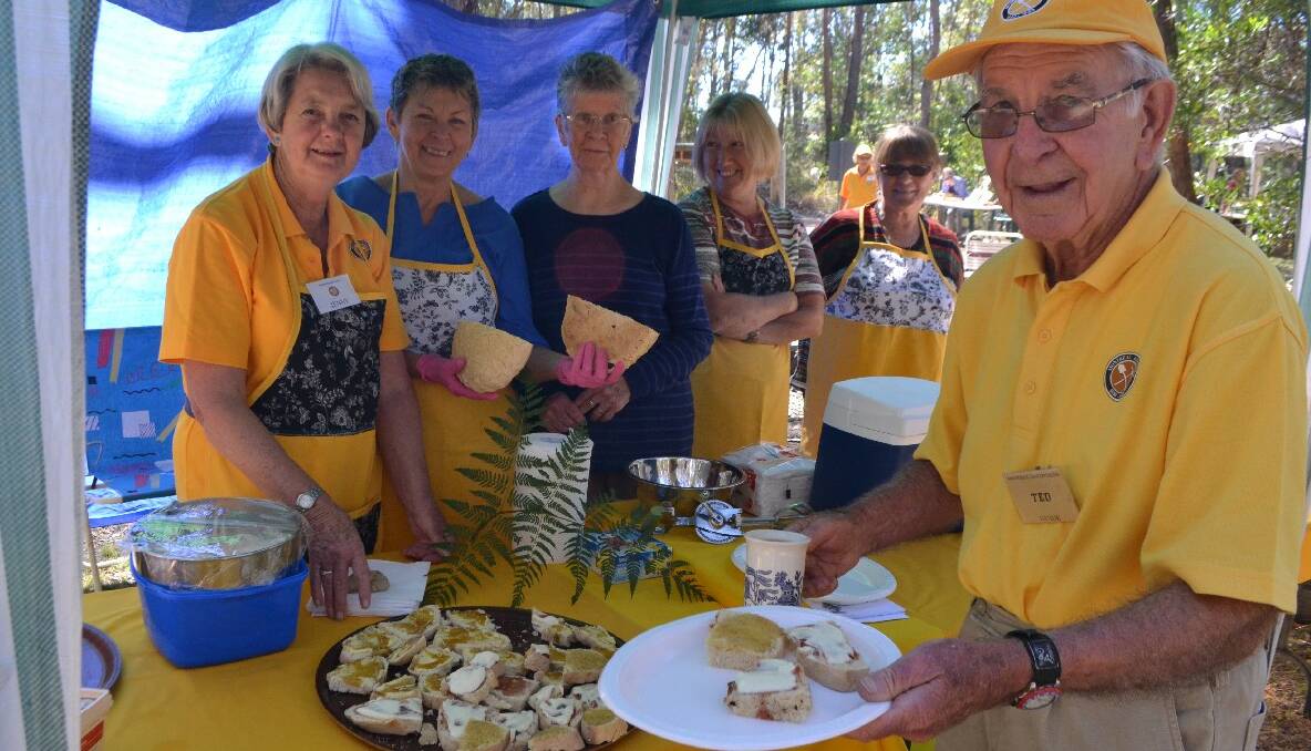 DAMPER TIME: Serving up freshly baked damper smothered in butter and jam are Montreal Goldfield volunteers Jenny Halliday, Helen Morris, Margaret Kenny-Levick, Jan Goodrich, Penny Murphy and Ted Hutt. 