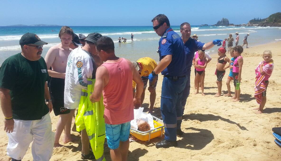 IN ACTION: NSW Ambulance paramedics and the VRA rescue squad members in action on Narooma surf beach. 