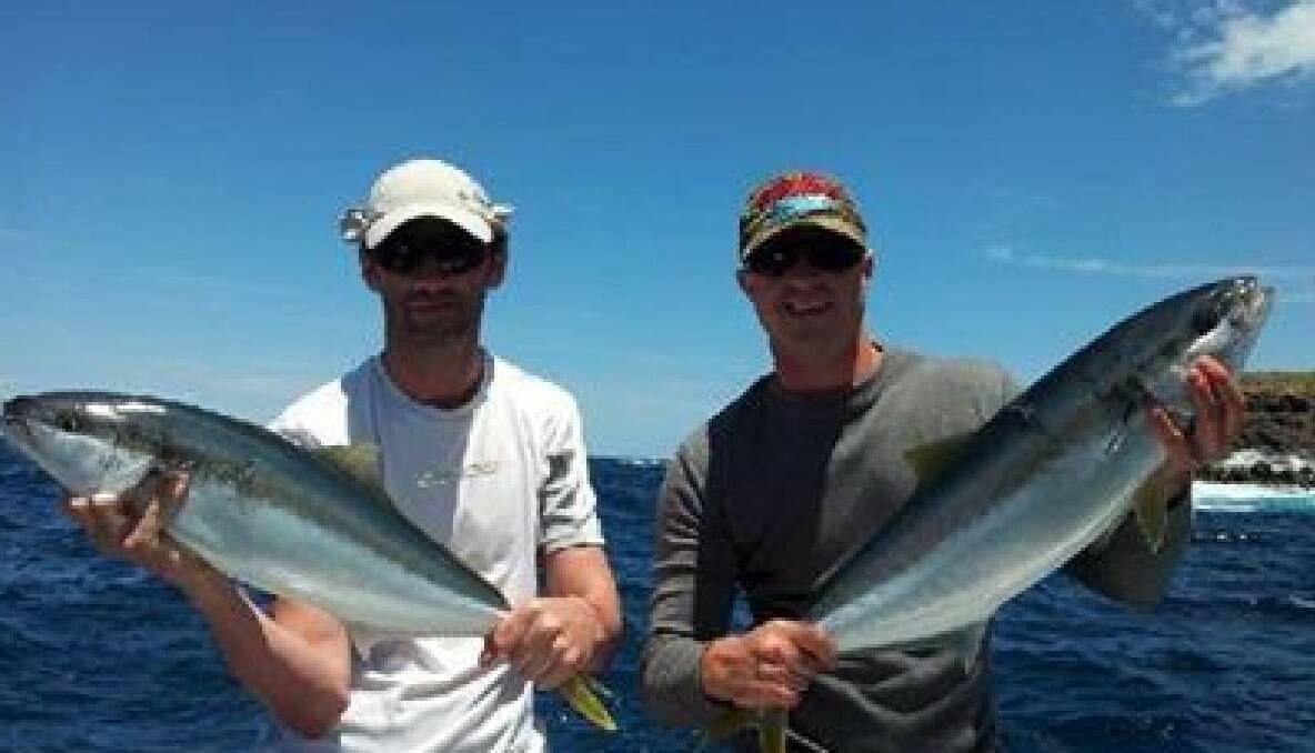 KING GUYS: A couple of happy customers who visited Narooma from Melbourne with kingfish on Playstation on Friday. 