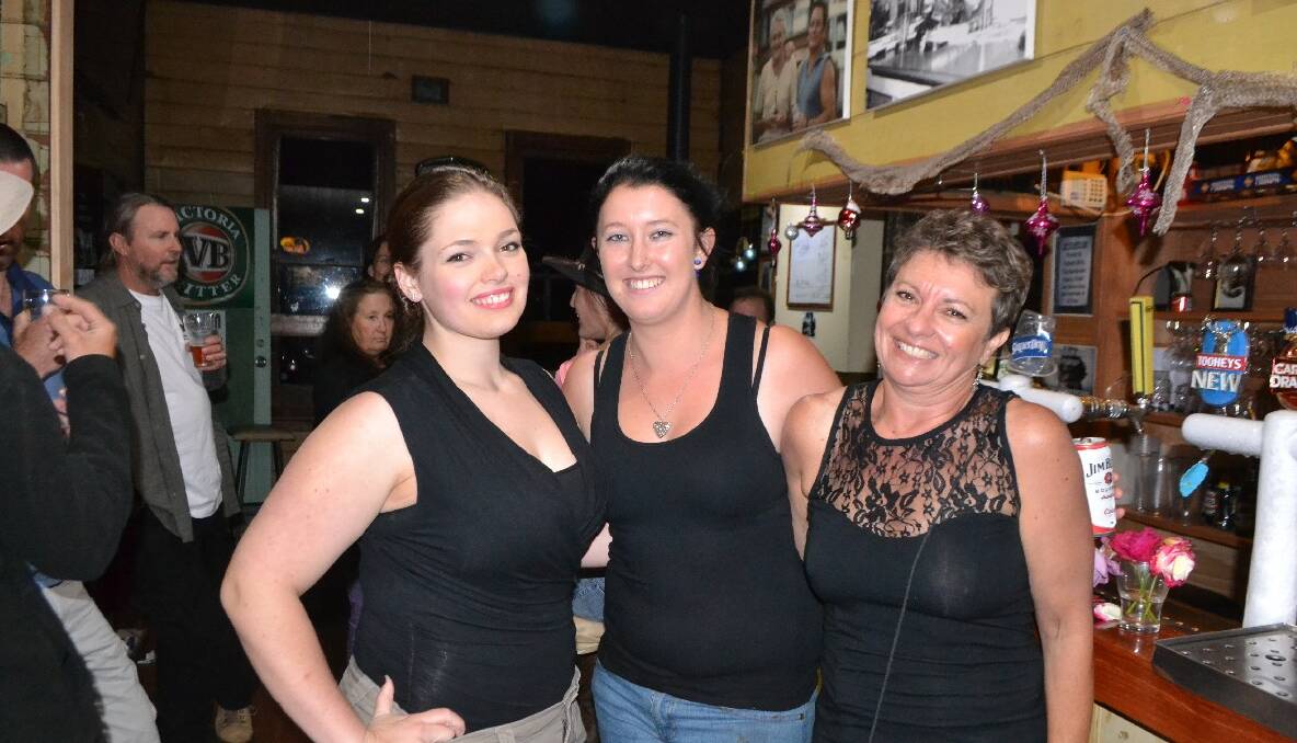   TILBA GIRLS: Enjoying the New Year’s Eve atmosphere at The Dromedary Hotel at Central Tilba are Georgie Facchetti, Erin Broadhead and Kim Atkins. Photo by Stan Gorton